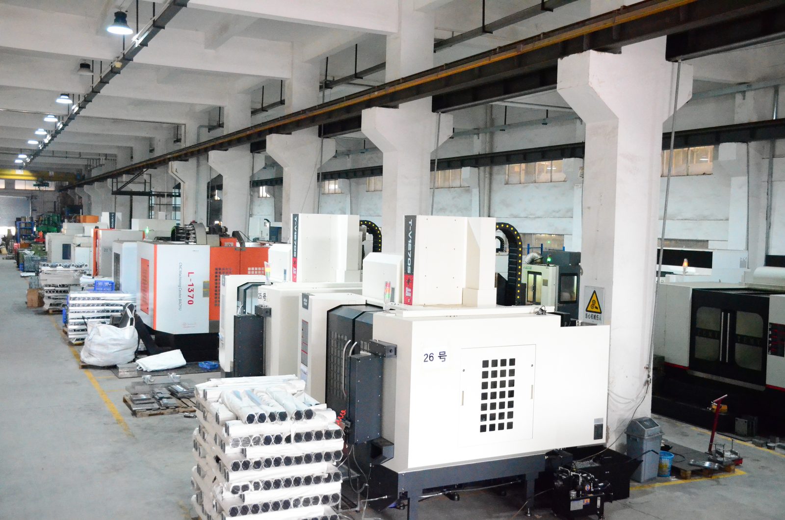 Rows of CNC machining centres on the production floor at the ALX battery case factory in Guangzhou