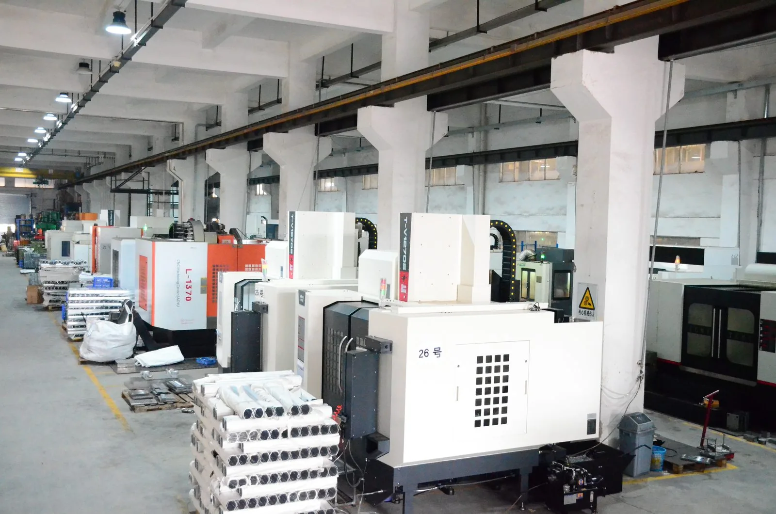 Rows of CNC machining centres on the production floor at the ALX battery case factory in Guangzhou