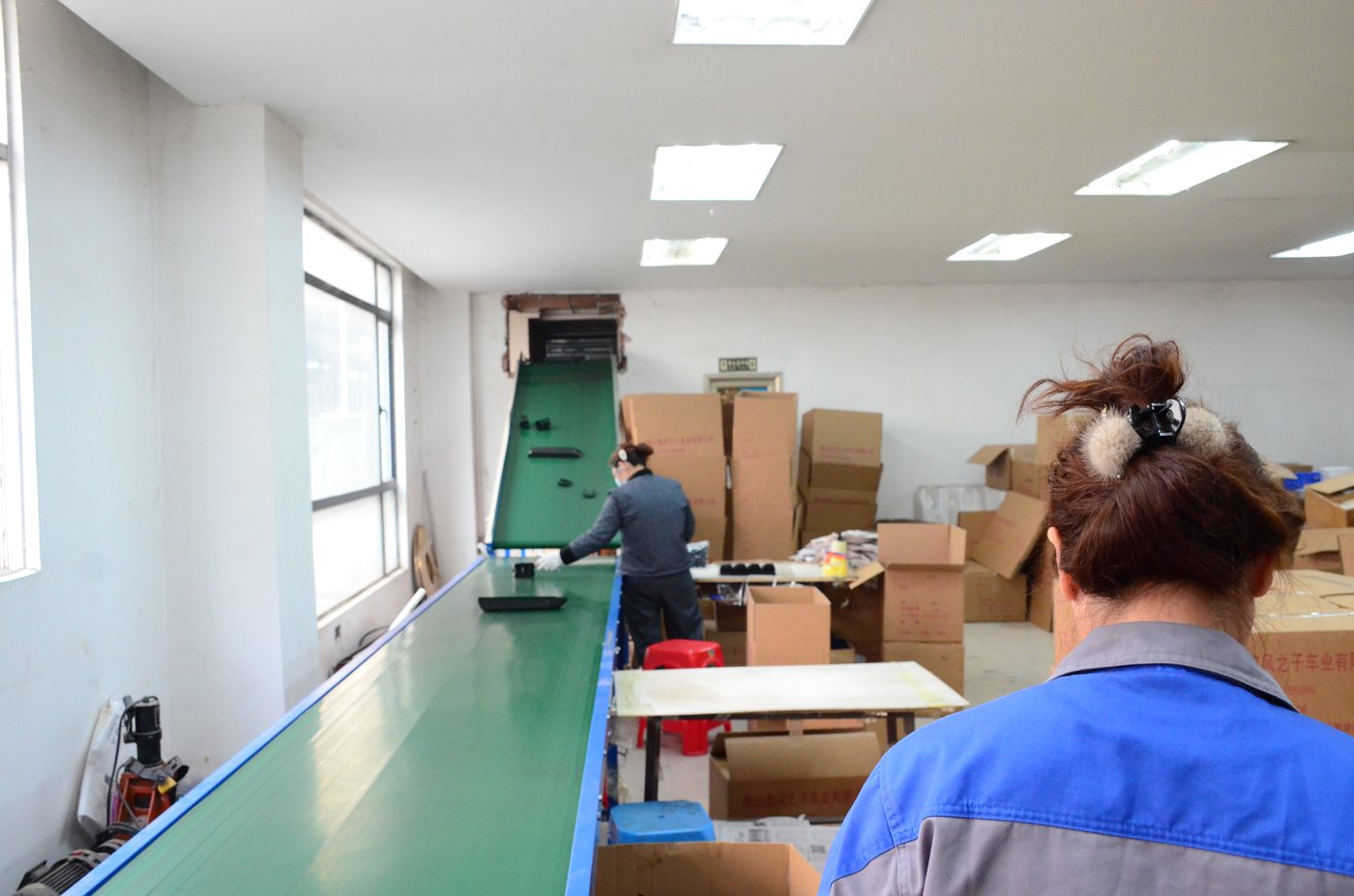 Packing line where finished battery cases are labelled, inspected and boxed